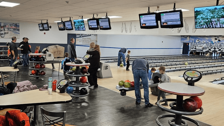 Families bowling at Root River