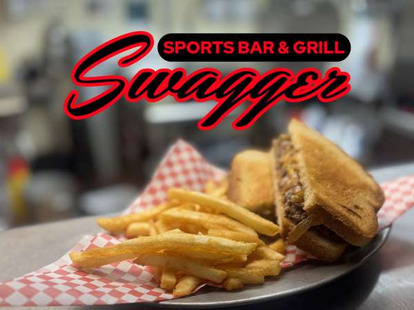 Plate of french fries and a fresh sandwich off the grill